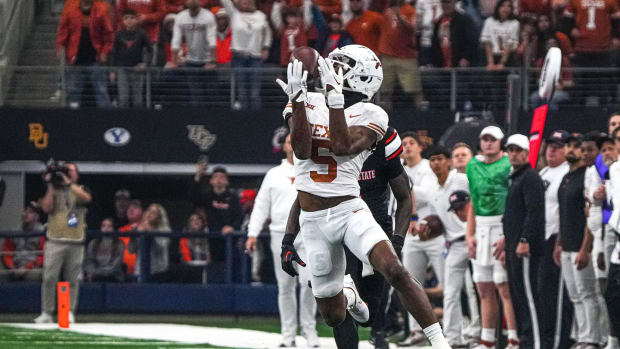 Big 12: Texas Longhorns wide receiver Adonai Mitchell (5) makes a catch for a first down against the Oklahoma State Cowboys.